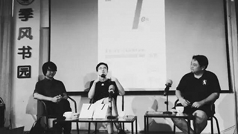 Three people talk ab